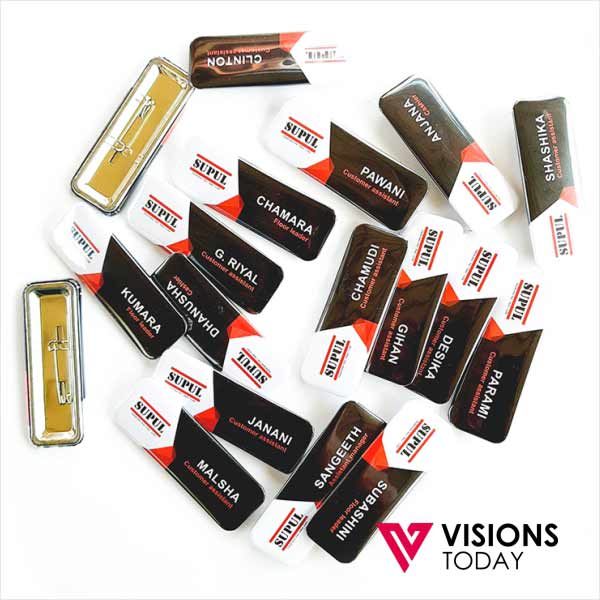 Visions Today offers rectangle pin badge printing in Colombo, Sri Lanka. We offer premium quality rectangle pin button badges with customized artworks and designs. These button badges are suitable for use as name badges, corporate branding as a tag, event promotion and as pin on badges.